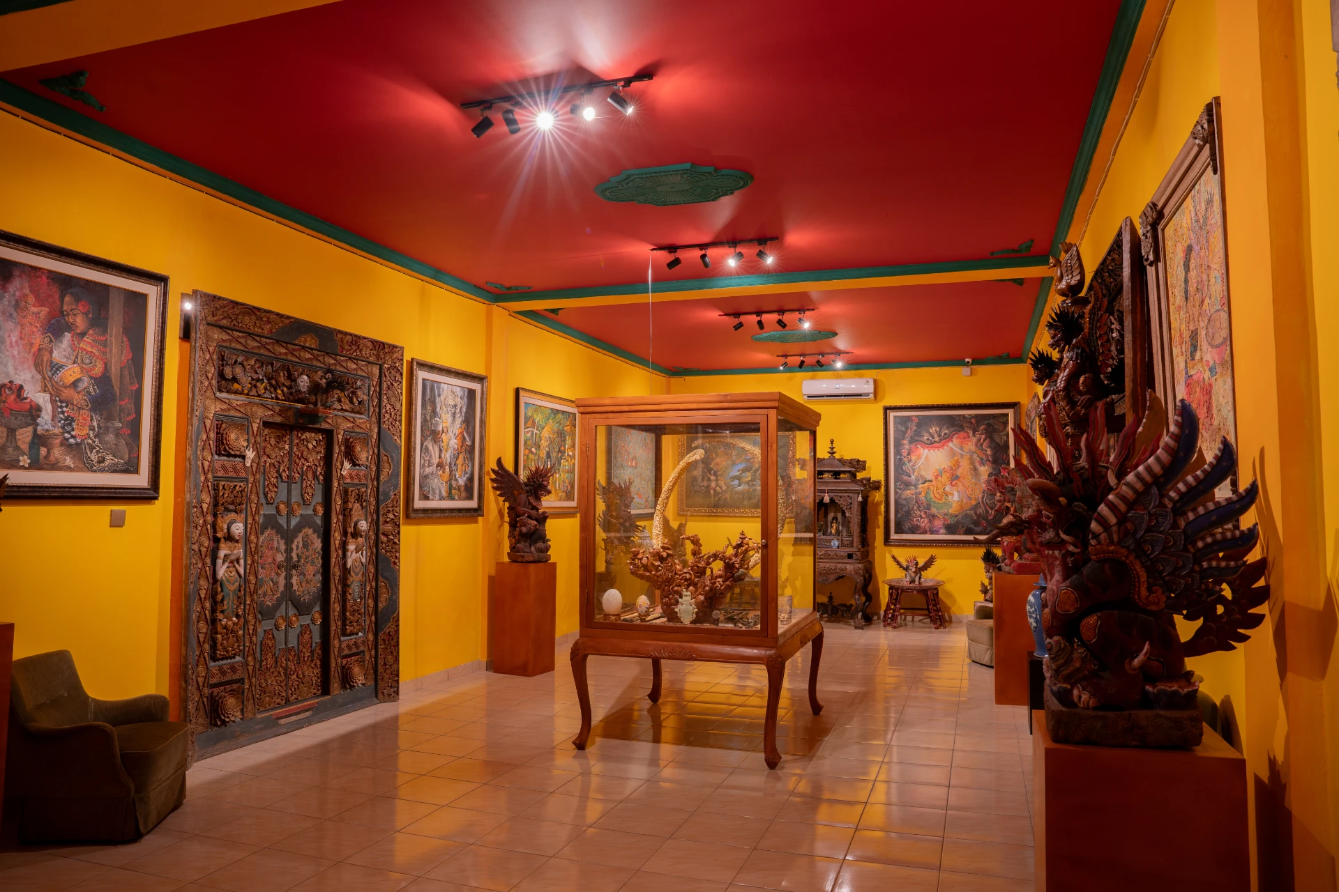 structure Balinese Bale Gede wooden pavilion with intricate hand-carvings, Museum Peter Bloch Collection.